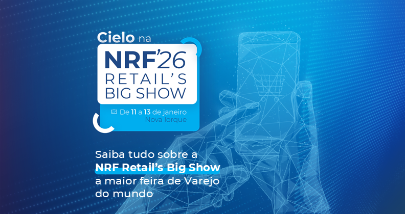 Imagem em tom azul da identidade visual da Cielo sobre participação na NRF 2026 Retail’s Big Show, maior feira de varejo do mundo, realizada de 11 a 13 de janeiro em Nova Iorque. Fundo azul com ilustração digital de mão segurando smartphone com ícone de carrinho de compras.