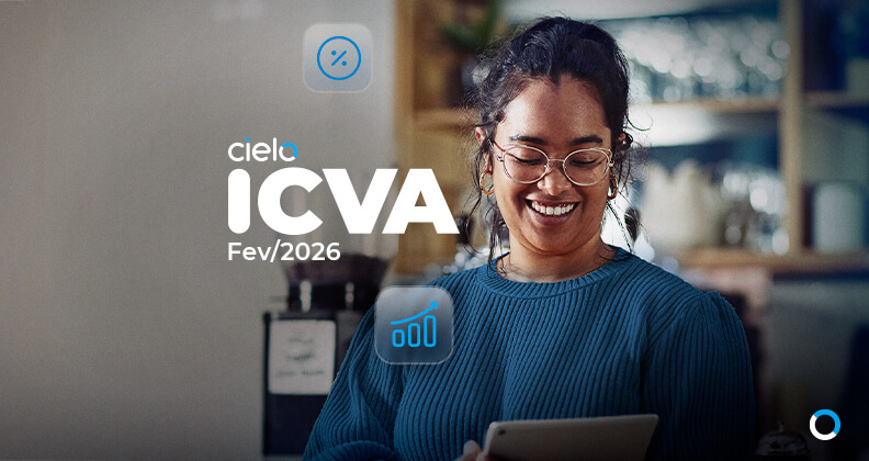 Banner do ICVA Cielo de fevereiro de 2026, mostrando uma pessoa utilizando um tablet em um ambiente de cafeteria, com ícones de indicadores de desempenho e o logotipo da Cielo sobrepostos