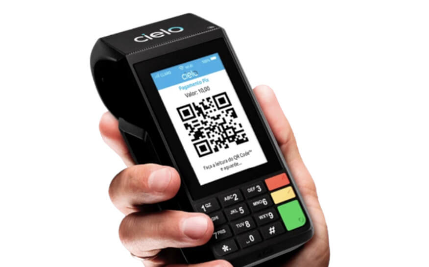 Maquininha Cielo exibindo QR Code para pagamento via Pix para negócios.