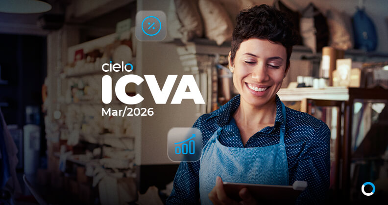 Imagem institucional da Cielo mostrando pessoa em ambiente de varejo, usando avental e consultando um tablet, com o texto “Cielo ICVA – Mar/2026”, representando o Índice Cielo do Varejo Ampliado e a análise de vendas no comércio brasileiro.