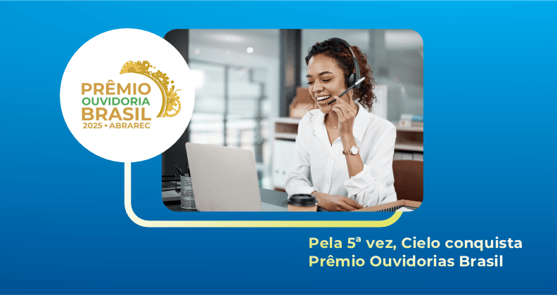 Imagem institucional do Prêmio Ouvidorias Brasil 2025 (ABRAREC): pessoa atendendo em central de atendimento, usando headset, sentada em frente a um notebook, representando serviço de ouvidoria e experiência do cliente. Texto na imagem: “Pela 5ª vez, Cielo conquista Prêmio Ouvidorias Brasil”