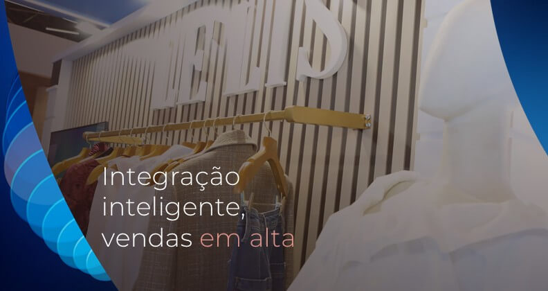 Espaço interno da loja Le Lis, que integra o grupo VESTE SA. Nela, vemos roupas organizadas em cabides e design moderno, com objetivo de ilustrar experiência de compra integrada e tecnologia de pagamentos. Sobre a imagem, é possível ler o texto “Integração inteligente, vendas em alta”, representando solução omnichannel da Cielo para varejo brasileiro.